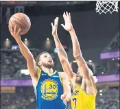  ?? ETHAN MILLER — GETTY IMAGES ?? Stephen Curry flips up a shot over former teammate JaVale McGee, now playing for the Lakers.