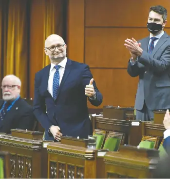  ?? JUSTIN TANG / THE CANADIAN PRESS ?? Justice Minister David Lametti gives a thumbs up in the House of Commons on Thursday as he rises to vote
in favour of a bill that expands access to medical assistance in dying. Bill C-7 passed by a vote of 212-107.
