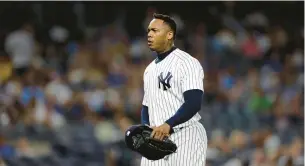  ?? ADAM HUNGER/AP ?? Yankees relief pitcher Aroldis Chapman had been scheduled to pitch batting practice Friday at Yankee Stadium, but the team said he instead was in Miami.