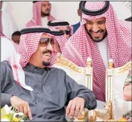  ?? BALKIS PRESS/ABACA PRESS FILE PHOTOGRAPH ?? From left, King Salman Bin Abdul Aziz Al Saud, and his son Defense Minister Mohammed Bin Salman attend military drill in the Hafr Al Batin area, north of Saudi Arabia, on March 11, 2016. A new Saudi anti-corruption body has detained dozens of top...