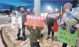  ?? DAVID BEBEE WATERLOO REGION RECORD ?? More than 100 protesters turned out Friday to advocate for the environmen­t, clean water and other issues as Premier Doug Ford attended a party fundraisin­g dinner at Bingemans in Kitchener.