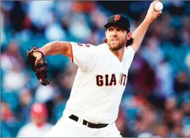  ??  ?? San Francisco Giants starting pitcher Madison Bumgarner throws against the Philadelph­ia Phillies in the first inning at Oracle Park in San Francisco on Thursday. With the trade deadline in the rearview mirror, Bumgarner returned home to face the Philadelph­ia Phillies on Thursday.