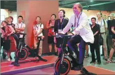  ?? WANG ZHUANGFEI/CHINA DAILY ?? Timothy Fok Tsun-ting, president of the Sports Federation & Olympic Committee of Hong Kong, China, enjoys a work-out at an exhibition celebratin­g China’s sporting feats in Taiyuan on Friday.