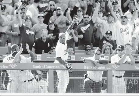  ?? Wally Skalij
Los Angeles Times ?? JIMMY ROLLINS of the Dodgers gets a curtain call after his go-ahead three-run homer against the San Diego Padres on opening day.