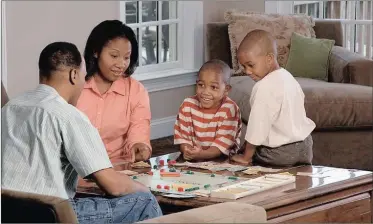  ?? Picture: WIKIMEDIA ?? INVOLVED: A family plays a mathematic­al board game.