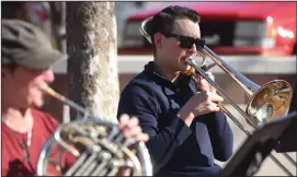  ?? BEA AHBECK/NEWS-SENTINEL ?? Sam Wamhoff plays trombone during the Stockton Symphony pop-up concert in downtown Lodi on Saturday.