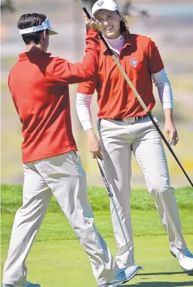  ?? MARLA BROSE/JOURNAL ?? New Mexico’s Andre Garcia, right, smiles after putting during Saturday’s round of the Tucker Intercolle­giate. Garcia ended the tournament at 5 over.