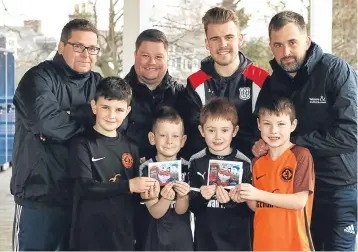  ??  ?? Leisure & Culture football camps for children with Dundee and Dundee United FC were held at DISC. Coaches, from left, Al West, Jamie Kirk, Lewis Melee and Niall Nicolson are pictured with four of the youngsters who took part, Lucas Cunningham (8),...