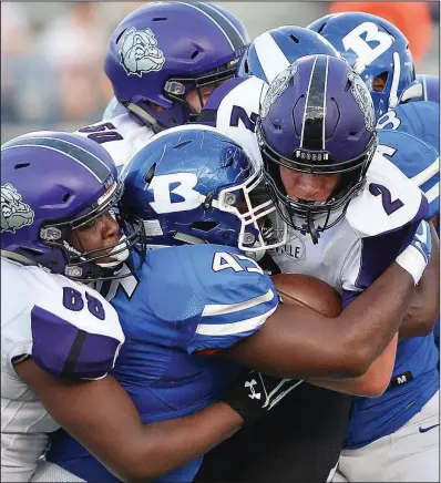  ?? Special to the Democrat-Gazette/JIMMY JONES ?? Bryant defender Austin Bailey won 36-35. (45) tackles Fayettevil­le receiver Connor Flannigan (2) during Friday’s game in Bryant. Fayettevil­le