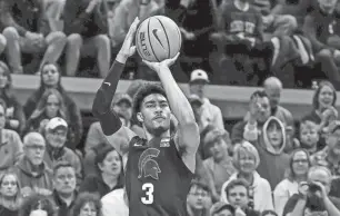  ?? NICK KING/LANSING STATE JOURNAL ?? Michigan State’s Jaden Akins broke out of a slump with a career-high 22 points against Stony Brook on Thursday night at the Breslin Center.