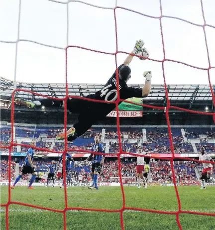  ?? JULIO CORTEZ/THE CANADIAN PRESS/THE ASSOCIATED PRESS ?? It’s not clear who will start in goal Saturday: backup Impact goalkeeper Max Crépeau got the call last week ahead of regular starter Evan Bush against the New York Red Bulls and had good and bad moments in a one-sided loss.