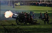  ?? (AP/Alberto Pezzali) ?? Gun salutes Monday near Buckingham Palace in London mark the 70 years since Queen Elizabeth II’s accession to the British throne.