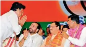  ?? — DC ?? Rajya Sabha MP Garikapati Mohan Rao greets BJP working president J.P. Nadda during a public meeting at Nampally on Sunday as Union minister of state for home G. Kishan Reddy and BJP national general secretary P. Muralidhar Rao look on.