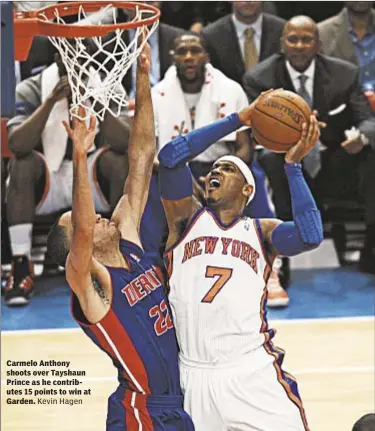  ??  ?? Carmelo Anthony shoots over Tayshaun Prince as he contribute­s 15 points to win at Garden. Kevin Hagen