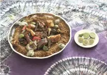  ??  ?? A PLATTER of thiebou dieune is served by Chef Touty Sarr, in Ngaparou, Senegal.