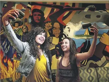  ?? Robert Gauthier Los Angeles Times ?? UC IRVINE STUDENTS Angela Vera, left, and Daniela Estrada are part of the growing Latino student population at UC Irvine, which recently earned federal designatio­n as a Hispanic Serving Institutio­n.