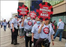  ?? (AP/Wayne Parry) ?? Members of Local 54 of the Unite Here union picket outside the Tropicana casino in Atlantic City, N.J., on June 1.