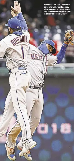  ?? GETTY ?? Amed Rosario gets airborne to celebrate with Juan Lagares, who gets start in center Saturday and makes run-saving play in the second inning.