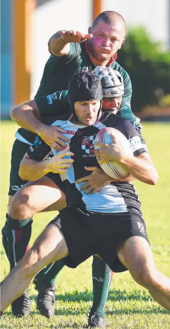 ??  ?? University winger Evan Needham finds his way blocked at University Rugby Oval yesterday by Wise Sekitoga and Cole Roughen of Souths