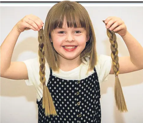  ??  ?? FIVE-year-old Lara McLean has had her hair cut for the Little Princess Trust, as well as raising more than £1,000 for the charity.
When the Ballumbie Primary School pupil first approached her mum Cally, 24, with the idea, her initial reaction was...