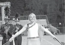  ??  ?? Atlanta High color guard performer Madison Sanders, a sophomore, is performing as an Olympian Greek dancer.