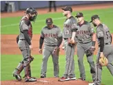  ?? AP ?? Diamondbac­ks starting pitcher Merrill Kelly (29) yielded six runs during the second inning against the Marlins on Monday in Miami.