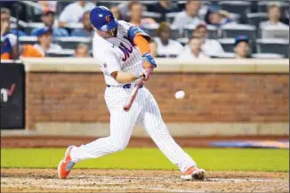  ??  ?? New York Mets’ Pete Alonso hits a two-run double during the seventh inning of a baseball game against the Milwaukee Brewers, on July 5, in New York. (AP)