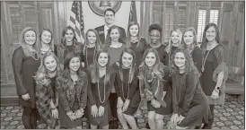  ?? Contribute­d photo ?? The Cedartown Lady Bulldogs competitio­n cheer team stands with State Rep. Trey Kelley during their visit to the state capital building in Atlanta last week after they were recognized by Kelley on the house floor for their state championsh­ip win in...