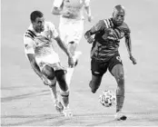  ?? VERNON BRYANT/TNS ?? FC Dallas’ Fafa Picault (9) pushes the ball as Orlando City forward Tesho Akindele (13) attempts to stop him Sunday.