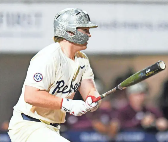  ?? BRUCE NEWMAN/SPECIAL TO THE CLARION LEDGER ?? Ole Miss designated hitter Will Furniss gets a single against Mississipp­i State on Friday at Swayze Field in Oxford.