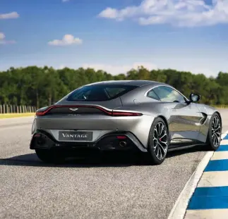  ??  ?? The previous generation Aston Martin Vantage S leads the Formula V1 race grid at the track
Aston Martin continues its legacy as a premium brand in the motoring industry