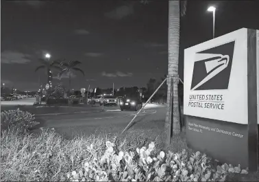  ?? JOSH REPLOGLE/AP PHOTO ?? Postal service police screen employees entering the Royal Palm Processing and Distributi­on Center on Thursday in Opa-locka, Fla. A law enforcemen­t source tells The Associated Press that Miami-Dade police have gone to the mailsortin­g facility in Opa-Locka, Fla., at the request of the FBI in connection with the suspicious package investigat­ion. The source says it was a precaution­ary measure.