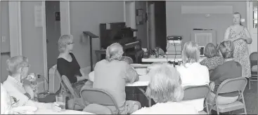  ?? John Popham / Rome News-Tribune ?? Beth Bond (standing at right) talks about climate justice with Rome and Cave Spring community members at Cave Spring First United Methodist Church during a seminar focusing on climate change.