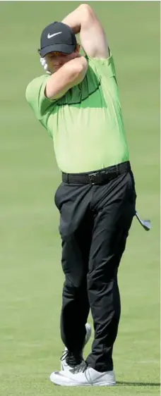  ?? DAVID CANNON/GETTY IMAGES ?? Rory McIlroy reacts to his poor second shot on the 18th hole during the first round of The Barclays in Farmingdal­e, New York on Thursday.