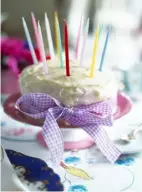  ??  ?? ABOVE RIGHT A homemade, simply iced cake can be decorated with a pretty ribbon and tall colourful candles ready to light for the occasion