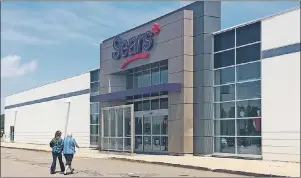  ?? STEPHEN BRUN/THE GUARDIAN ?? Shoppers enter the Sears store in Charlottet­own, P.E.I., on Tuesday. Sears Canada says there is “significan­t doubt” about its future as it announced a $144.4-million loss on Tuesday.