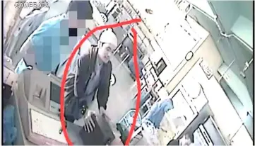  ??  ?? The CCTV shows the suspect taking the charity box from the restaurant.