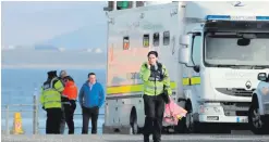  ??  ?? Gardai and search teams on the Mayo coast yesterday