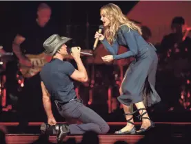  ?? ANDREW NELLES/TENNESSEAN.COM ?? McGraw, performing with his wife, Faith Hill, in 2017, says, “Faith, to me, is one of greatest singers in the world.”