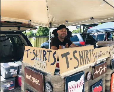  ?? PHOTOS BY ALEXIS OATMAN — THE NEWS-HERALD ?? WataTees owner Thomas Karpy says he’s happy to be at the market in Eastlake.