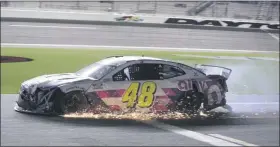  ?? TERRY RENNA - THE ASSOCIATED PRESS ?? Jimmie Johnson drives his damaged car on pit road during the NASCAR Cup Series auto race at Daytona Internatio­nal Speedway, Saturday, Aug. 29, 2020, in Daytona Beach, Fla.
