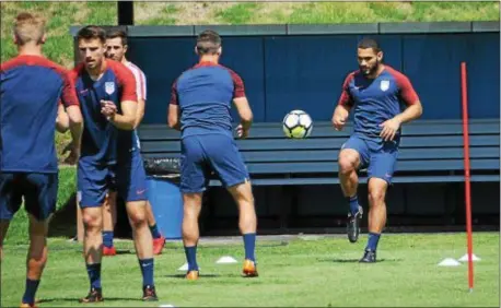  ?? MICHAEL REEVES — FOR DIGITAL FIRST MEDIA ?? Defender Cameron Carter-Vickers, right, warms up with Eric Lichaj during U.S. national team training at the University of Pennsylvan­ia Monday. The 20-year-old Carter-Vickers is one of the highly touted young players who could state a convincing case...
