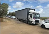  ?? (Standing Together) ?? A CONVOY of Israeli volunteers delivering food to Gaza.