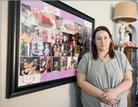  ?? NICK CAMMETT/ASSOCIATED PRESS ?? Jessica Day-weaver poses next to a picture collage made for her daughter, Anastasia, at her home, Thursday, Feb. 2, 2022, in Boardman, Ohio.