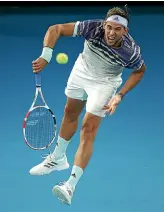  ?? GETTY IMAGES ?? Dominic Thiem powers down a serves in his semifinal win over Alexander Zverev on Friday night in Melbourne.