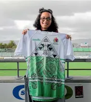  ??  ?? UCOL student Heneriata Te Whata, with the new jersey she designed for the Manawatu¯ Ma¯ori rugby team.