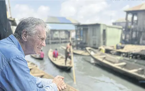  ?? PICTURE: BBC/TWO CITIES TELEVISION/TODD ?? Sir Michael Palin’s trip to Nigeria proved a welcome distractio­n following the death of his wife Helen last year