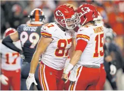  ?? AP ?? The Chiefs’ Travis Kelce, left, celebrates his touchdown catch with Patrick Mahomes.