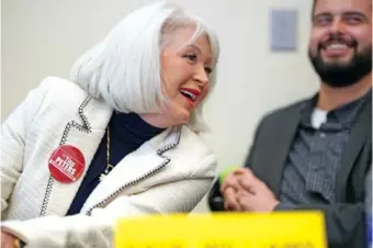  ?? Colo. AP PHOTO/DAVID ZALUBOWSKI ?? Candidate for the Colorado Republican Party chair position Tina Peters, left, jokes with fellow candidate Dave Williams during a debate Saturday sponsored by the Republican Women of Weld at a pizza restaurant in Hudson,