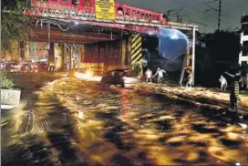  ?? PTI PHOTO ?? The sudden downpour, which lasted for five hours on Monday night, was initially described as a cloud burst but later reclassifi­ed as heavy rainfall.